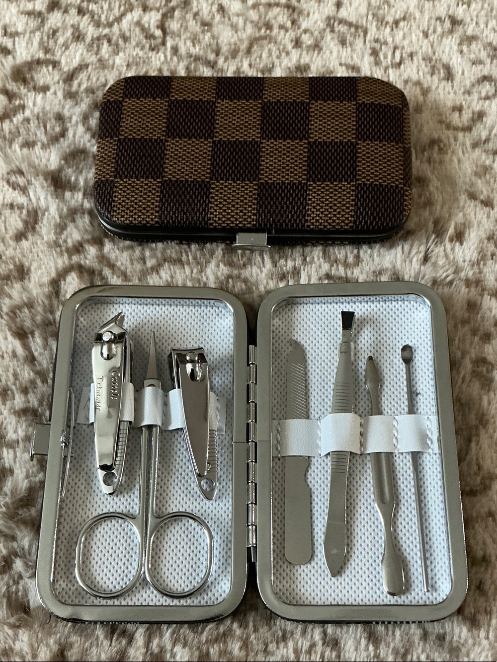 Brown Checker Pattern Case with 8-piece manicure and pedicure grooming kit set.